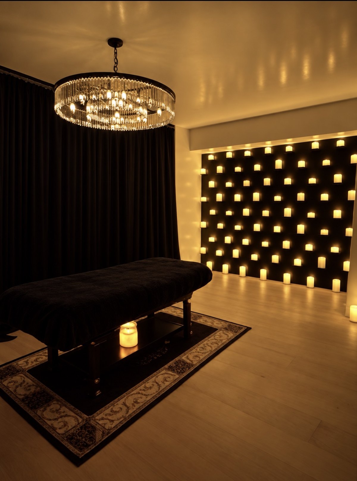 Studio with crystal chandelier and a wall of candles